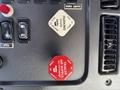 Dashboard controls of a 2012 Freightliner M2 112 featuring parking brake and air supply indicators