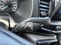 Close-up of the control stalk for windshield wipers and turn signals in a 2022 Ford Transit vehicle
