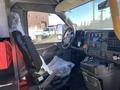 Interior view of a 2020 Chevrolet Express van showing the driver's seat dashboard and control panel