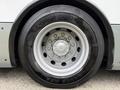 Close-up of a silver wheel with a Goodyear tire on a 2018 Grande West Vicinity showing detailed rim and tire tread