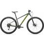 A 2025 Specialized Rockhopper mountain bike featuring a green frame with yellow accents 26-inch wheels and wide tires designed for off-road cycling