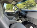 Interior of a 2016 Ford F-750 featuring a driver's seat and dashboard with various controls and an open passenger side highlighted