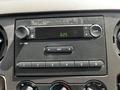 Dashboard of a 2009 Ford F-550 featuring a radio display with time and audio controls