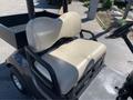 A 2017 Yamaha Golf Cart G29 E with a beige two-seat bench in the front and a black body with a steering wheel