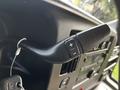 A steering wheel control stalk with buttons for adjusting settings in a 2017 Chevrolet Express