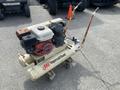 2000 Wilkerson Refrigerated Air Dryer and Ingersoll-Rand Air Compressor with a red and black engine mounted on a beige air tank with visible rust on the frame