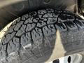 A close-up of a rugged tire tread on a 2017 RAM Promaster showing deep grooves for traction and wear from use