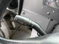 Close-up of the turn signal lever on a 2018 Ford E-450 showing the control for headlights and windshield wipers