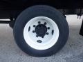 Close-up of a white wheel with a black tire labeled Continental mounted on a 2014 International Durastar vehicle