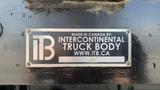 A metal nameplate displaying the logo and information for Intercontinental Truck Body attached to a truck body