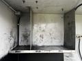 A 2006 GMC C5000 with a weathered exterior and two shelves in the rear compartment showing signs of wear and dirt