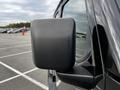 Close-up of the side mirror of a 2019 Jeep Wrangler showcasing its square shape and black finish