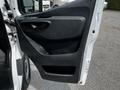 A 2019 Mercedes-Benz Sprinter van door interior showing the handle and panel design without any additional features or decorations