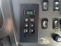 Control panel of a 2012 Freightliner M2 112 featuring buttons for gear selection and monitoring functions