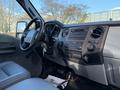 Interior of a 2012 Ford F-350 showcasing the dashboard with controls and seating in a gray color scheme