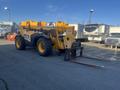 A 2013 JCB 510-56 Loadall with a yellow and black color scheme, equipped with a front lifting arm and forks for handling materials