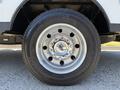 A close-up view of a chrome wheel with a Ford logo on a 2023 Ford F-550 tire showcasing the Continental branding on the tire sidewall