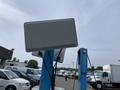 2003 U-Built Reel Trailer featuring a gray rectangular box mounted on a blue frame with wires connected to it