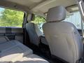 Interior view of a 2017 Ford F-350 SD showing the back seats with light gray upholstery and headrests