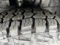 Close-up view of the tread on a tire from a 2022 Ford Transit showing deep grooves and rugged patterns designed for traction and durability