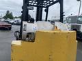 A 2010 Hyster S80XLBCS forklift with a yellow body and propane tank attached at the back