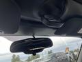 Interior view of a 2005 Chrysler PT Cruiser showing the rearview mirror and overhead hand grip without additional details or features