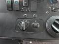 Control panel of a 2018 Ford E-450 featuring knobs and buttons for lights climate control and information display