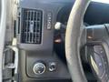 Interior view of a 2016 GMC Savana dashboard showing air vent controls steering wheel and various buttons