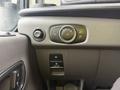 Dashboard controls of a 2023 Ford Transit including headlight switch and other buttons