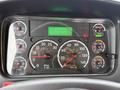 Close-up of a 2016 Freightliner 108SD dashboard showing various gauges for speed fuel temperature and RPM along with an odometer displaying 26777.2 km