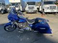 A 2017 Harley-Davidson FLHXS motorcycle in blue with a sleek design features a comfortable seat and chrome accents