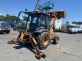 A 2008 Case Super 580M backhoe loader with a yellow and black exterior features a front bucket and rear digging arm parked on a construction site