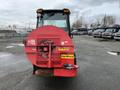 A 2014 John Deere 1585 Terrain Cut with a large red front attachment and yellow branding on the side