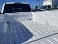 White 2019 Ford F-150 truck bed with a smooth floor and high sides