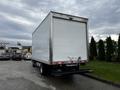 2018 Hino 195 box truck with a white cargo area and a rear loading dock step