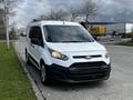 2016 Ford Transit Connect in white with a black front grille parked on a street