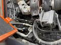 A close-up of the engine components of a 2018 Doosan DL300-5 showing various pipes and electrical connections