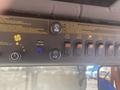 Control panel of a 2010 Trackless MT6 showing various switches and buttons for operating attachments and vehicle functions
