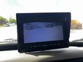 A monitor displaying a rearview camera feed from a 2017 International WorkStar 7600 showing a clear view of the area behind the vehicle