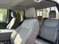 Interior view of a 2021 Ford F-150 showing two front seats with gray fabric upholstery and headrests
