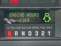 A digital display panel showing engine hours at 3369 and a fuel indication for ultra low sulfur diesel fuel only