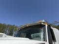 The image shows the cab of a 2009 International 7500 truck with clear visibility of its large windshield and metallic roof mounted lights