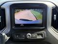 Rearview camera display showing a parking area from the perspective of a 2021 Chevrolet Silverado 1500 dashboard