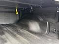 A 2018 RAM 1500 truck bed with textured walls and a smooth floor showing no cargo or equipment inside