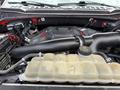 Close-up of the engine compartment of a 2019 Ford F-150 highlighting the air intake and coolant reservoir