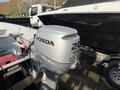 A 2017 ShoreLandr WC16 trailer with a Honda BF20 outboard motor mounted on the back