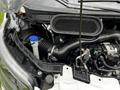 Close-up view of the engine compartment of a 2023 Ford Transit showing the air intake assembly and various components
