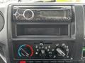 Dashboard of a 2019 Hino 195 displaying a car stereo with Bluetooth capabilities and various climate control knobs
