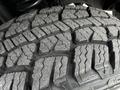 Close-up of a rugged tire tread from a 2020 Ford F-350 SD showing deep grooves and patterns designed for traction and off-road performance