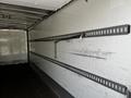 2019 International 4300 empty truck interior featuring metal track systems on the walls for securing cargo